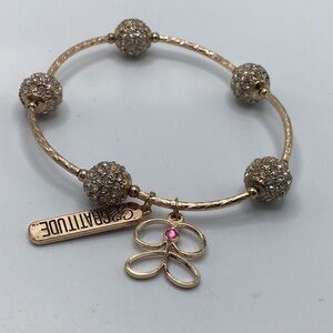 Gold Tone Stretch Gratitude Bracelet with Pink Accent